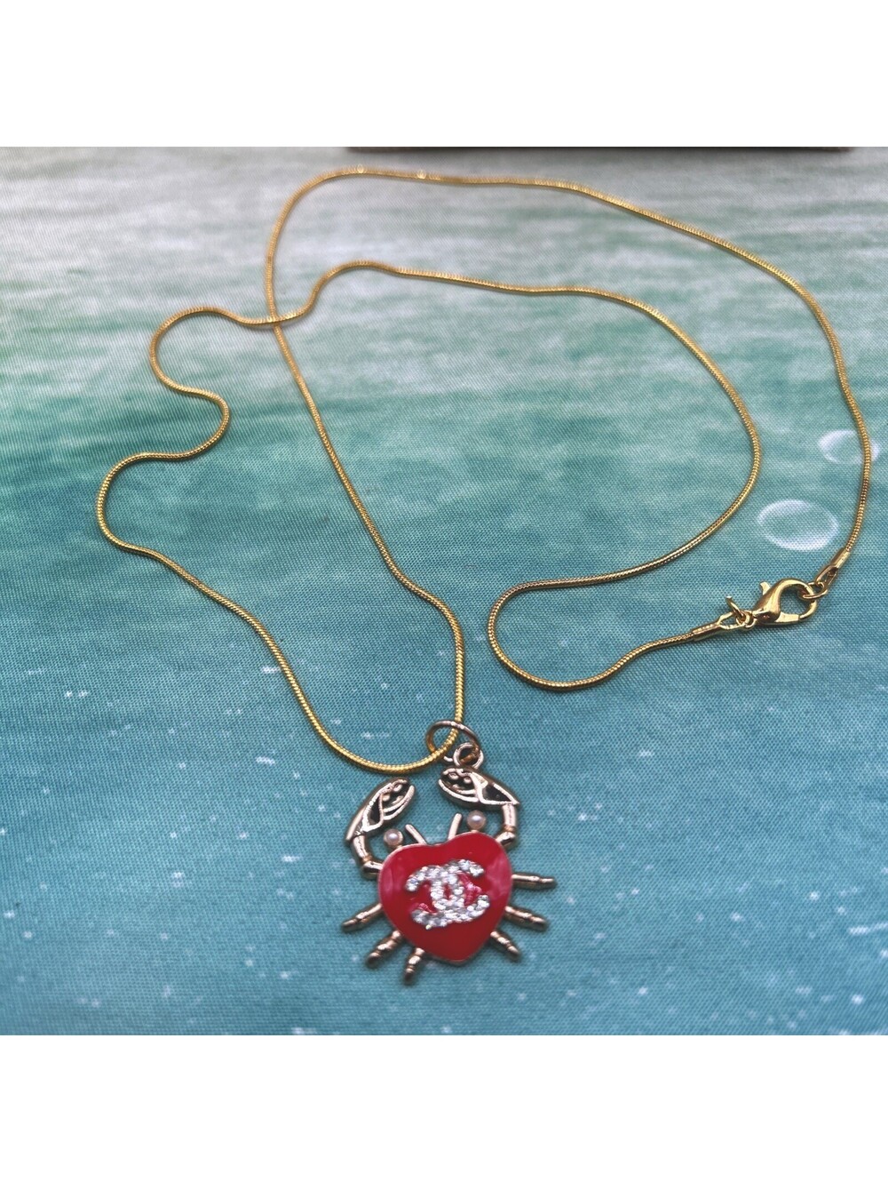 Chanel Red/Gold Crab Charm with Red Enamel & Rhinestones On a 24” Gold chain NIB